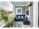 Cozy outdoor patio area with comfortable wicker seating and stylish tropical accents at 305 Flowering Peach Ct # 202, Charleston, SC 29414