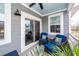 Relaxing screened-in patio with comfortable seating and view of surrounding community at 305 Flowering Peach Ct # 202, Charleston, SC 29414