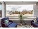 Covered porch offers outdoor seating and a view of the surrounding neighborhood at 305 Flowering Peach Ct # 202, Charleston, SC 29414