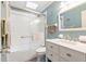 Bathroom with a shower/tub combo, white vanity, and blue walls at 313 Houston Dr, Ladson, SC 29456