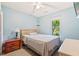 Cozy bedroom featuring hardwood floors, soft blue walls, and ample natural light at 313 Houston Dr, Ladson, SC 29456