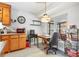 Eat-in kitchen featuring wood cabinetry, modern flooring, and a breakfast nook with a vintage chandelier at 313 Houston Dr, Ladson, SC 29456