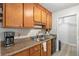 Functional kitchen with a stainless steel sink, wooden cabinets, and modern appliances at 313 Houston Dr, Ladson, SC 29456