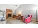 Cozy living room features a brick fireplace, vaulted ceiling and stylish wood-look floors at 313 Houston Dr, Ladson, SC 29456
