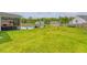 Expansive backyard features a pool, seating area, and lush green lawn, perfect for outdoor activities and entertaining at 3173 Hugh Bennett Dr, Johns Island, SC 29455