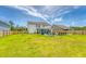 Spacious backyard featuring a patio seating area and a lush green lawn, perfect for outdoor entertaining at 3173 Hugh Bennett Dr, Johns Island, SC 29455