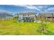 Large backyard featuring a private pool, lounge area, and well-maintained lawn at 3173 Hugh Bennett Dr, Johns Island, SC 29455