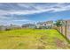 Lush backyard showcasing a pool, lounge seating, and secure fencing at 3173 Hugh Bennett Dr, Johns Island, SC 29455
