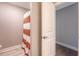 Bathroom with orange and white striped shower curtain at 3173 Hugh Bennett Dr, Johns Island, SC 29455