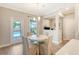 Bright breakfast nook features a modern chandelier and a view of the backyard pool at 3173 Hugh Bennett Dr, Johns Island, SC 29455