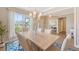 Bright dining room with large window, light fixture, and modern decor for elegant gatherings at 3173 Hugh Bennett Dr, Johns Island, SC 29455
