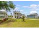 Charming two-story home with double porches, dormer windows and a lush lawn at 3173 Hugh Bennett Dr, Johns Island, SC 29455