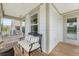 Charming front porch featuring a swing and a comfortable bench, perfect for enjoying the outdoors at 3173 Hugh Bennett Dr, Johns Island, SC 29455