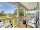 Relaxing front porch with comfortable seating, a porch swing, and a view of the surrounding neighborhood at 3173 Hugh Bennett Dr, Johns Island, SC 29455