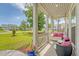 Relaxing front porch featuring a porch swing with pink pillows and comfortable outdoor seating at 3173 Hugh Bennett Dr, Johns Island, SC 29455