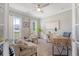 Bright and airy home office featuring neutral decor, large windows, and modern furniture at 3173 Hugh Bennett Dr, Johns Island, SC 29455