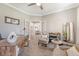 Spacious home office with stylish desk, comfortable seating, and French doors leading to other rooms at 3173 Hugh Bennett Dr, Johns Island, SC 29455