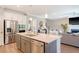 Open kitchen with stainless steel appliances, a large island, and seamless flow to living spaces at 3173 Hugh Bennett Dr, Johns Island, SC 29455