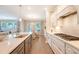 Bright and airy kitchen featuring an island, a gas range, and access to a dining area at 3173 Hugh Bennett Dr, Johns Island, SC 29455