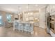 Well-lit kitchen showcases a modern island, stainless appliances, and an open design to dining area at 3173 Hugh Bennett Dr, Johns Island, SC 29455