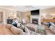 Cozy living room boasts a fireplace, comfortable seating, and elegant decor for relaxation at 3173 Hugh Bennett Dr, Johns Island, SC 29455