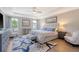 Spacious main bedroom features a tray ceiling, sitting area, and large windows at 3173 Hugh Bennett Dr, Johns Island, SC 29455