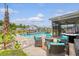 Relaxing pool area with a grill, fire pit, and lounge chairs perfect for outdoor entertaining and relaxation at 3173 Hugh Bennett Dr, Johns Island, SC 29455