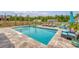 Inviting in-ground pool with spa and poolside seating, surrounded by lush landscaping, creating a private retreat at 3173 Hugh Bennett Dr, Johns Island, SC 29455