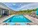 Inviting in-ground pool with a travertine deck and comfortable lounge chairs, offering a relaxing outdoor experience at 3173 Hugh Bennett Dr, Johns Island, SC 29455