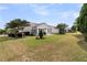 A sprawling backyard featuring mature trees and lush lawn, ideal for outdoor activities and relaxation at 318 Oyster Bay Dr, Summerville, SC 29486