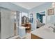 Bathroom showcasing a glass shower, vanity with makeup mirror, and bedroom view at 318 Oyster Bay Dr, Summerville, SC 29486