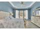Primary bedroom features a decorative tray ceiling, ample natural light, and neutral-toned furnishings at 318 Oyster Bay Dr, Summerville, SC 29486
