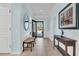 Inviting foyer with tile floors, a bench, and an elegant console table, leading to the living areas at 318 Oyster Bay Dr, Summerville, SC 29486