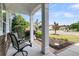Inviting front porch with seating, perfect for enjoying neighborhood views and summer evenings at 318 Oyster Bay Dr, Summerville, SC 29486