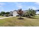 Charming single-story home in Oyster Bay, featuring a well-manicured lawn and mature trees at 318 Oyster Bay Dr, Summerville, SC 29486