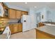 Well-lit kitchen showcasing wooden cabinets, modern appliances, and ample countertop space for meal preparation at 318 Oyster Bay Dr, Summerville, SC 29486