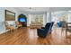 Bright living room with hardwood floors, a ceiling fan, and large windows offering natural light at 318 Oyster Bay Dr, Summerville, SC 29486