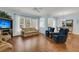 Bright, open-concept living room with hardwood floors, ceiling fan, and seamless flow to other spaces at 318 Oyster Bay Dr, Summerville, SC 29486