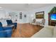 Spacious living room featuring hardwood floors, blue walls, and open access to adjacent living areas at 318 Oyster Bay Dr, Summerville, SC 29486