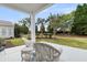 Relaxing patio seating area with a clear view of the beautifully landscaped backyard at 318 Oyster Bay Dr, Summerville, SC 29486