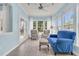 Inviting sunroom bathed in natural light, featuring comfortable seating and a view of the outdoors at 318 Oyster Bay Dr, Summerville, SC 29486