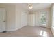 Bedroom featuring neutral walls, carpet, ceiling fan, closet and exterior door at 321 Bounty Ln, Charleston, SC 29412