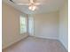 Bright bedroom with a ceiling fan, a large window, and neutral-toned walls at 321 Bounty Ln, Charleston, SC 29412