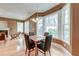 Cozy dining area with hardwood floors, bay window, and modern chandelier lighting at 321 Bounty Ln, Charleston, SC 29412