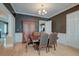 Formal dining room features beautiful hardwood floors, dark walls, and elegant trim at 321 Bounty Ln, Charleston, SC 29412