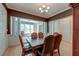 Elegant dining room with hardwood floors, decorative chandelier, and stylish furnishings at 321 Bounty Ln, Charleston, SC 29412