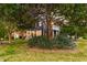A picturesque home is surrounded by verdant trees, creating a sense of seclusion at 321 Bounty Ln, Charleston, SC 29412