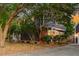 Charming two-story home with a landscaped yard surrounded by mature trees at 321 Bounty Ln, Charleston, SC 29412