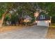 The home features a spacious detached garage and mature landscaping at 321 Bounty Ln, Charleston, SC 29412