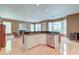 Open-concept kitchen with stainless steel appliances, granite counters, and hardwood floors at 321 Bounty Ln, Charleston, SC 29412